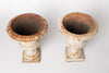 Pair small antique french cast iron urns with original paint
