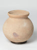 Vintage terracotta water carrying pot on stand
