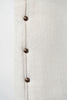 Vintage upholstered ottoman footstool on castors