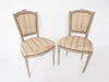 Pair Antique French Painted Chairs with bow garland crest
