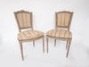 Pair Antique French Painted Chairs with bow garland crest
