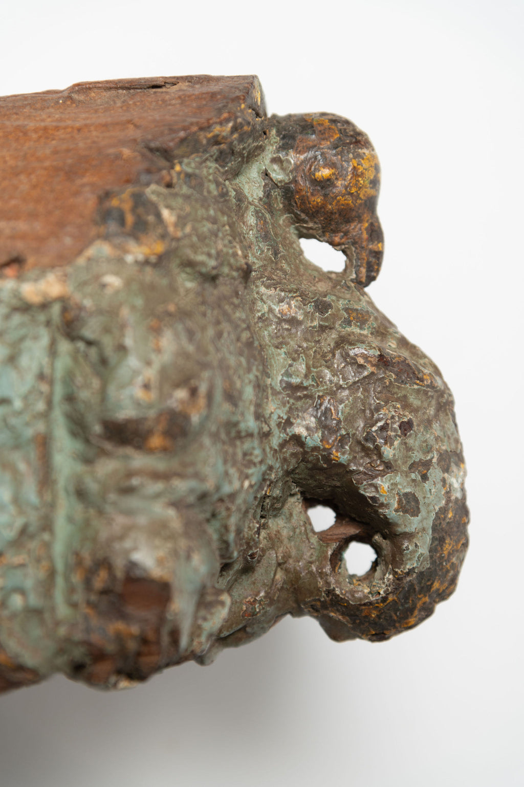 Two reclaimed Indian architectural salvage wall sconces, with original green paint