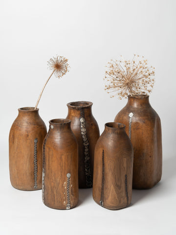 Vintage handcrafted African wooden honey pots with metal repairs