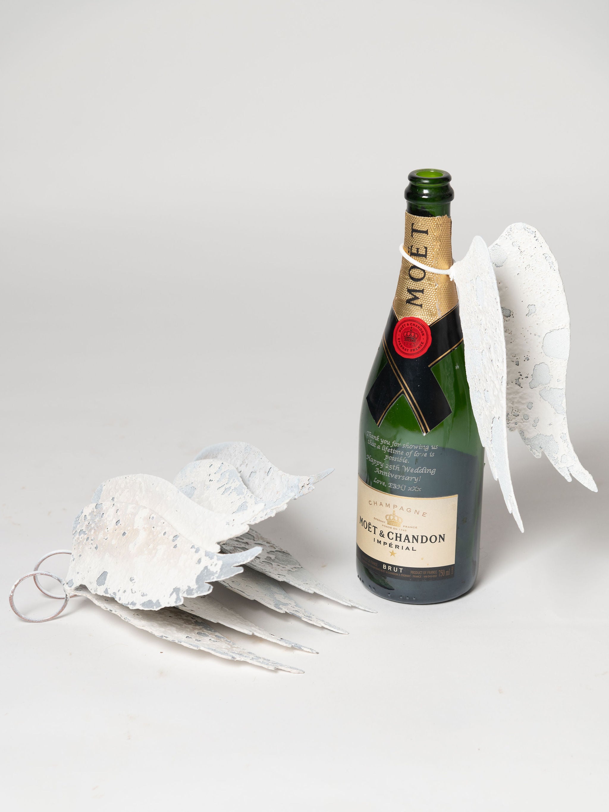 Hand crafted aged metal angel wings for bottles