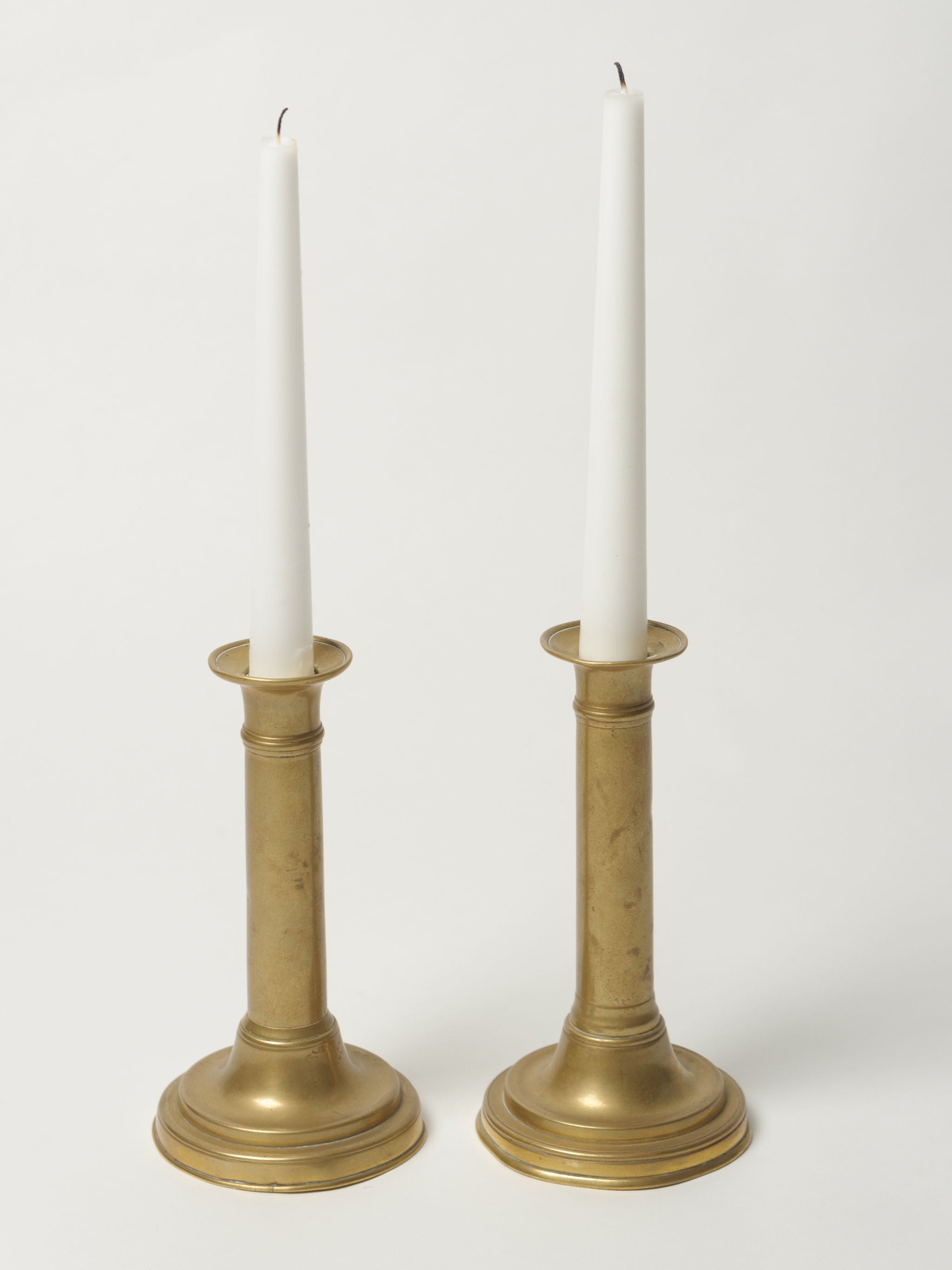 antique brass push-up candle holders pair