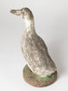 Vintage garden stone duck with old paint