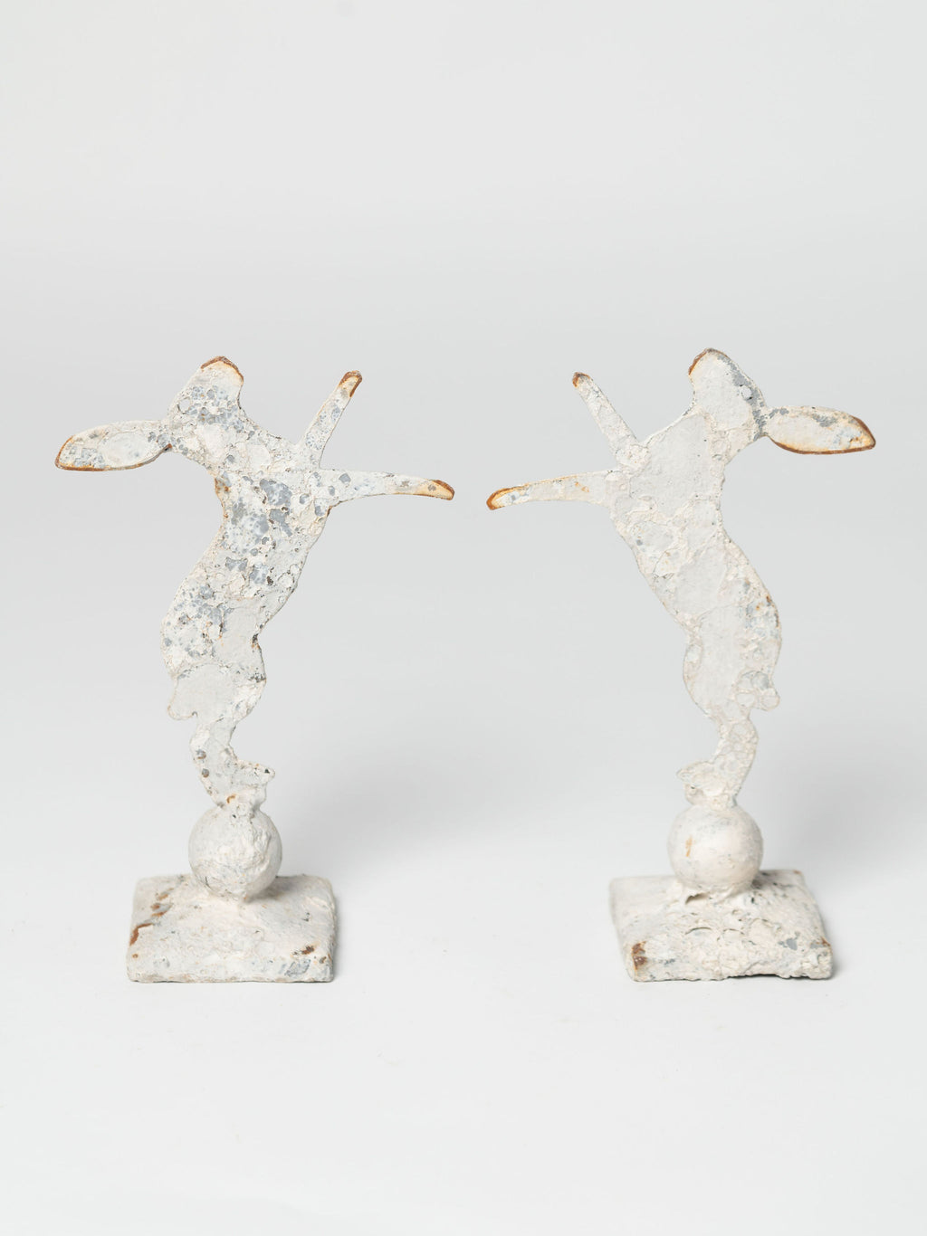 Handcrafted miniature metal boxing hares on stands