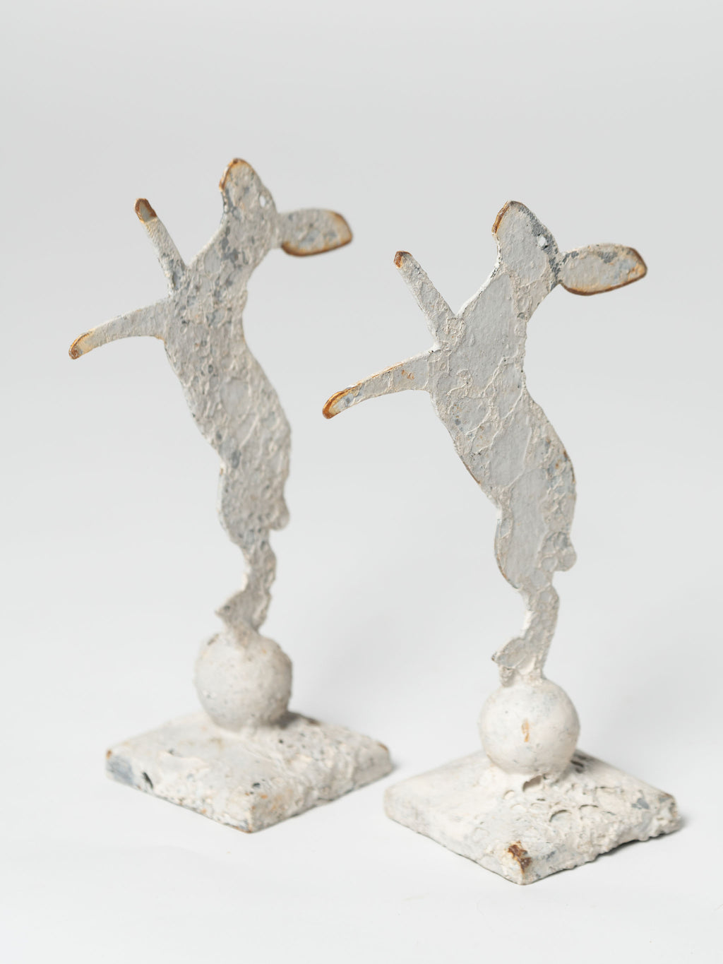 Handcrafted miniature metal boxing hares on stands