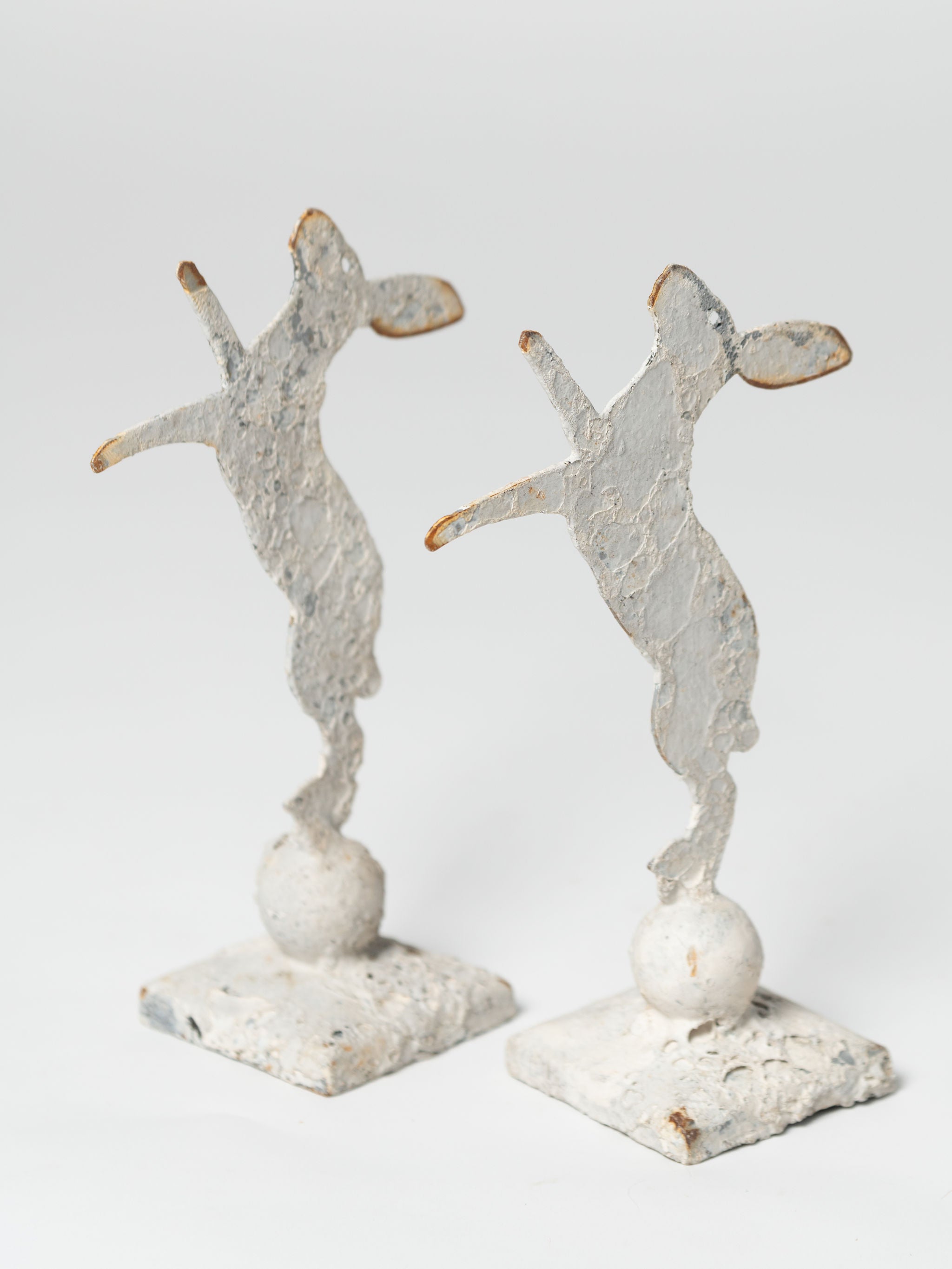 Handcrafted miniature metal boxing hares on stands